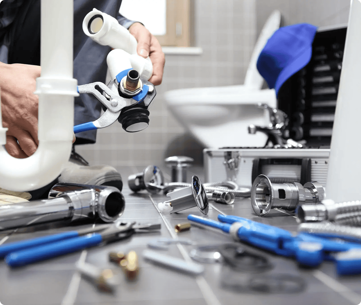 Plumber fixing bathroom pipes